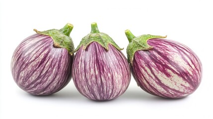 Obraz premium Three vibrant purple eggplants rest elegantly on a clean white surface, showcasing their glossy texture and rich color.