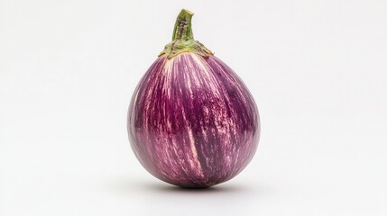 Fototapeta premium A vibrant purple eggplant rests on a clean white background, showcasing its glossy skin and fresh green stem, embodying natural beauty and freshness.