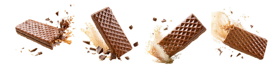 Chocolate wafer bar breaking and crumbling with dynamic pieces in motion isolated on transparent background