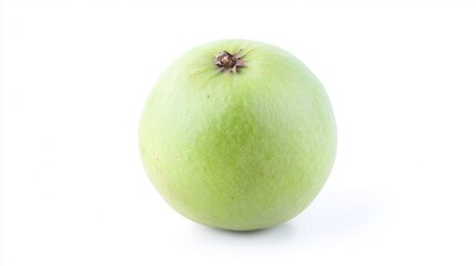 A fresh green apple rests on a clean white surface, showcasing its vibrant color and smooth texture in a minimalist setting.