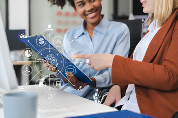Diverse professionals collaborate on project analysis with financial graphs. Strategic teamwork and...