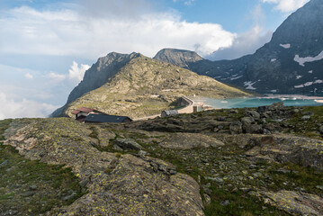 Lago della Rossa dam with peaks above in Graian Alps in Italy