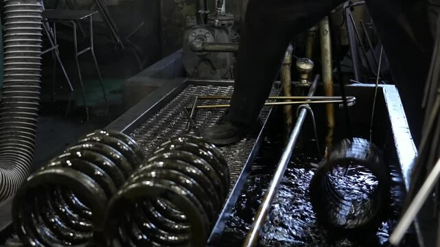 A specialized furnace is used in an industrial facility to calcinate metal springs, ensuring high-temperature treatment for enhanced durability and performance.
