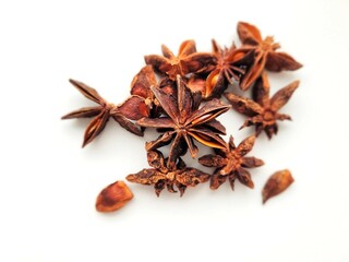 Pile of raw anise on a bright background.