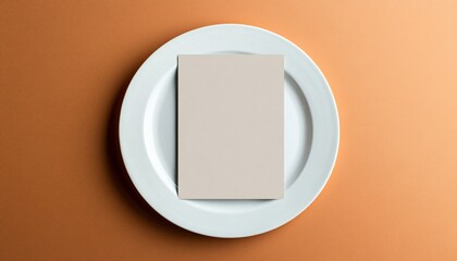 Elegant blank menu mockup displayed on a simple white plate, perfect for showcasing your dining options and enhancing your restaurant's aesthetic appeal. Ideal for menu presentation concepts.