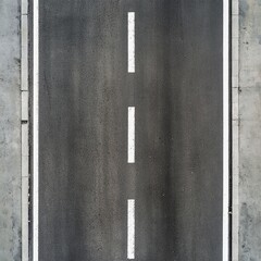 Overhead view of asphalt road with center line markings.