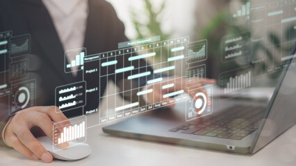 Project management concept. Site manager working with Gantt chart schedule to plan tasks and progress. Planning software. Corporate strategy for construction, finance, operations, sales, marketing.