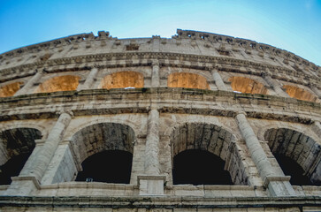 Obraz premium Iconic View of the Colosseum in Rome, Italy Ancient Architecture and History,The majestic Colosseum in Rome, Italy, stands as a symbol of ancient Roman engineering and cultural grandeur