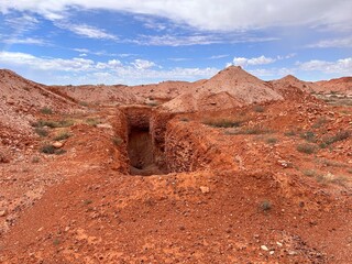 Coober Pedy, in South Australia, is the opal capital of the world, famous for its underground homes, churches, and shops built to escape the desert heat, offering a unique outback experience.