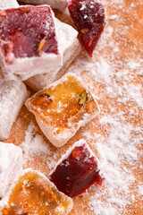 Sweet food Turkish delight, assorted rahat locum in form of cubes with nuts and powdered sugar, traditional food
