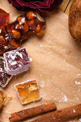 Sweet food Turkish delight on wooden background, assorted locum and candy as decorated backdrop