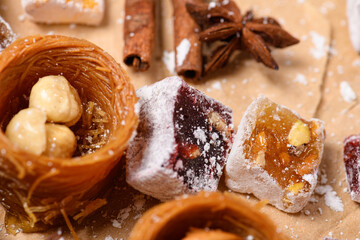 Sweet food Turkish delight on wooden background, assorted locum and candy, decorated backdrop