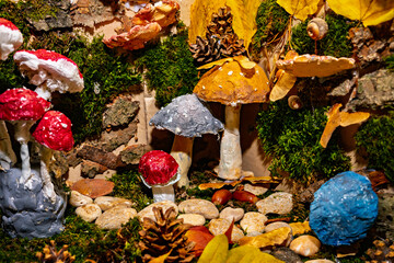 Colorful fungi and natural elements create a whimsical forest display