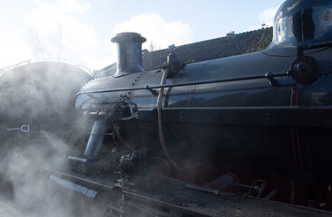 Steam locomotive  in cloud of smoke