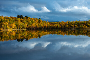 Fototapeta premium Sunrise lake in autumn. Abisko national park in north of Sweden.