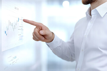 Businessman pointing at digital chart with futuristic interface