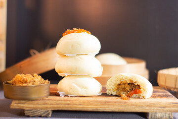 Three dumplings are stacked on top of each other