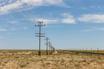 Electric and communication lines alongside railway in Mangystau Region, Kazakhstan