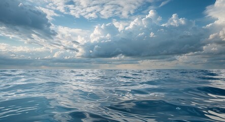 Fototapeta premium Water texture with gentle ripples and cloudy sky background