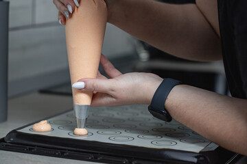 A confectioner making macarons
