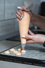 A confectioner making macarons