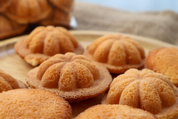 Side view Thai egg cake with or as it is known in Thai, Khanom Khai Made by baking.  Similar to French Madeleines