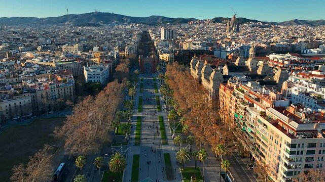 drone view of Barcelona at sunset, avenue of the Arch of Triumph in Barcelona, tourism in Catalunya, Barcelona