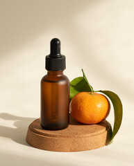 Vitamin C serum in dark matte glass bottle, selective focus, copy space. Shadows and sunlight
