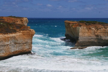 London Bridge, along the Great Ocean Road, is a natural rock formation that once resembled a bridge. It collapsed in 1990, leaving two rock pillars, creating a unique coastal landmark.