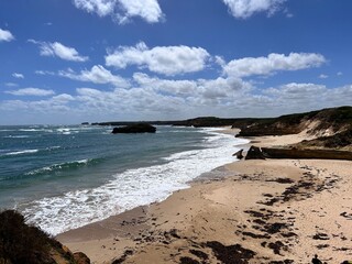 Port campbell in Great Ocean Road, in Victoria, Australia, is a scenic coastal drive famed for landmarks like the Twelve Apostles, rugged cliffs, lush rainforests, beaches, and charming seaside towns.