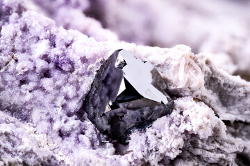 Bixbyite with purple fluorite and cherry topaz. Specimen from Cubic #2 claim, Thomas Range, USA. macro photography detail texture background. close-up mineral crystal unpolished semi-precious
