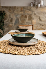 Elegant dining setup with handcrafted bowls and natural elements