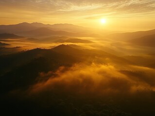 Obraz premium Golden Sunrise Over Misty Mountain Ranges A Serene Landscape View