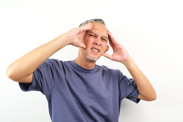 Naklejka premium Portrait of Adult Asian Man showing stress expression. Suffering migraine. 
