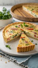 Partially Eaten Quiche Lorraine Served with Fresh Greens and Garnish