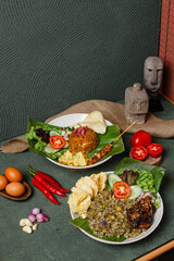 Plates of Fried Rice with Chicken Satay, Beef Ribs, and Crackers