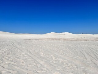 Lancelin, a coastal town in Western Australia, is famous for its white sand dunes, perfect for sandboarding, off-road adventures, pristine beaches, windsurfing, and a relaxed atmosphere.