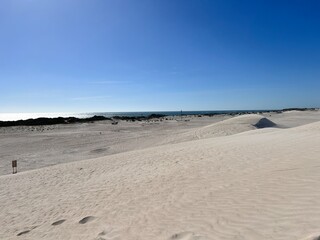 Lancelin, a coastal town in Western Australia, is famous for its white sand dunes, perfect for sandboarding, off-road adventures, pristine beaches, windsurfing, and a relaxed atmosphere.
