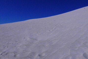 Lancelin, a coastal town in Western Australia, is famous for its white sand dunes, perfect for sandboarding, off-road adventures, pristine beaches, windsurfing, and a relaxed atmosphere.