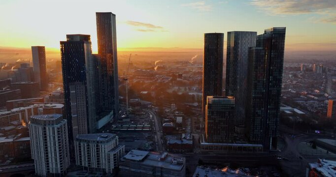 Aerial video of Manchester skyline at Sunrise. 