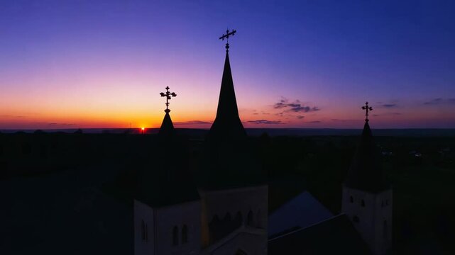 Timelapse silhouette of a church christian from sunrise to sunset shot from above high drone pray religiion bibble cinematic 4k