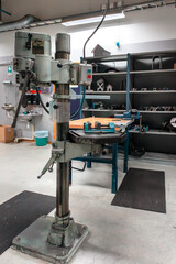 Uddevalla, Sweden - 01162025 An Industrial Drill Press in a WellEquipped Workshop for Various Crafting Activities