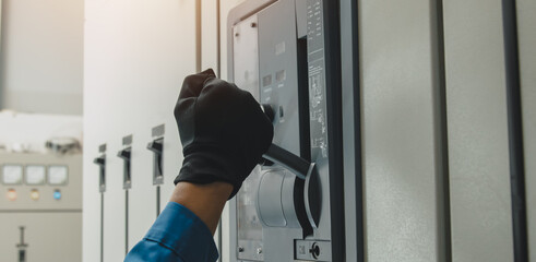 Electrical equipment maintenance service engineer Engineers carry AC voltmeters to check voltage at...