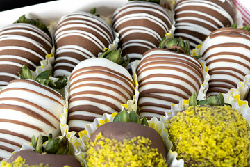 Strawberries in white and brown chocolate.