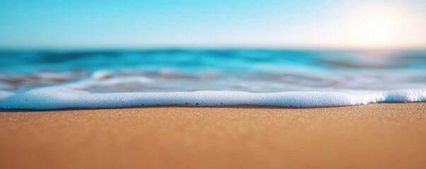 Obraz premium Serene Beach View for Ultimate Rest with Calm Waves at Sunset Over Sandy Shore