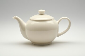 A simple, elegant white teapot with a rounded body and a curved spout, resting against a neutral background.