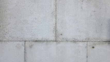 Concrete walls and floors with grunge dividing lines as background texture. Modern cement wall texture, grey front panel, background. 