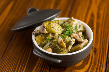 Brussel sprouts stewed in sour cream sauce with mushrooms and spices