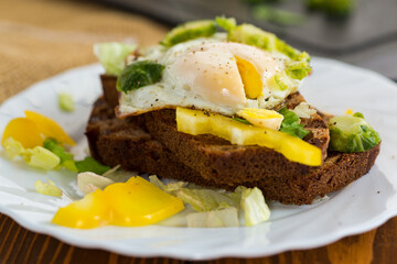 Breakfast with rye bread and greens