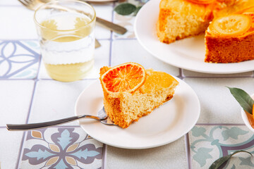 Orange cake with fruit citrus slices.